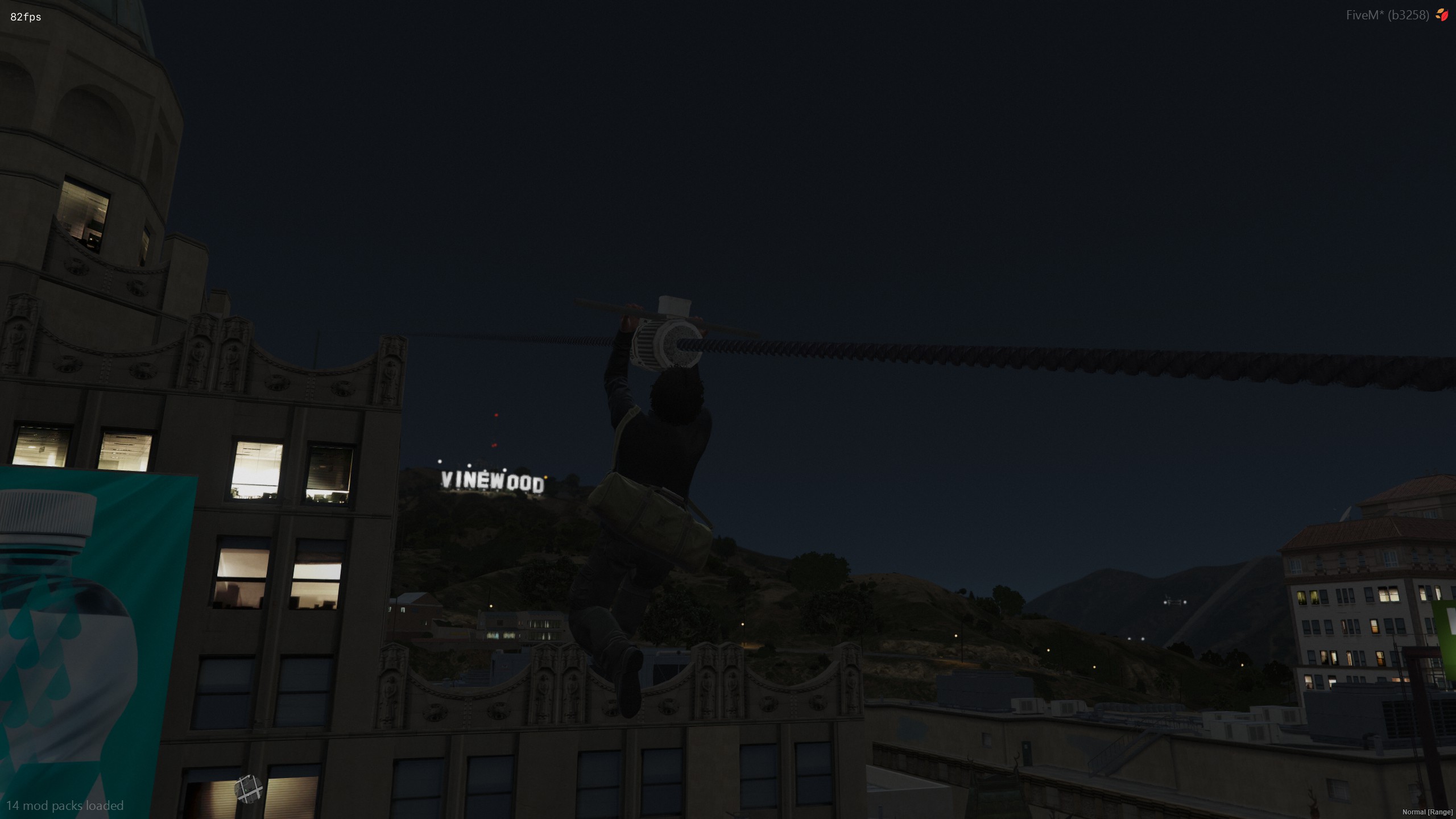 Player using a zipline across rooftops at night
